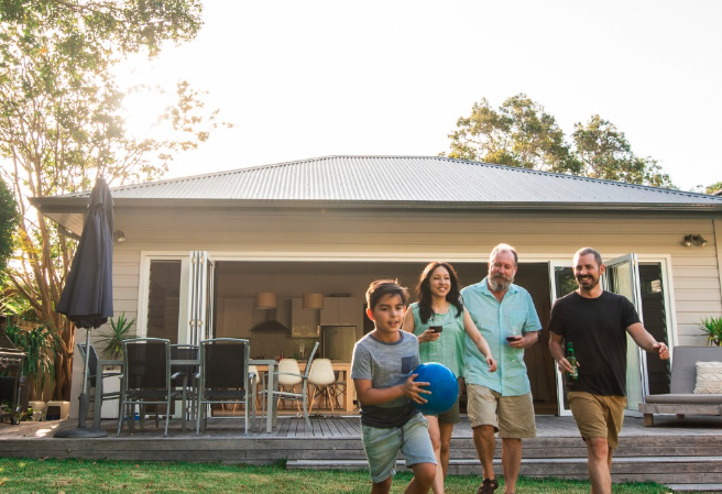 Family enjoying the backyard of their home